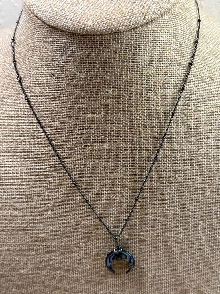 The Giving Keys Black Crescent Pendant Necklace With Iridescent Blue-Green Sheen